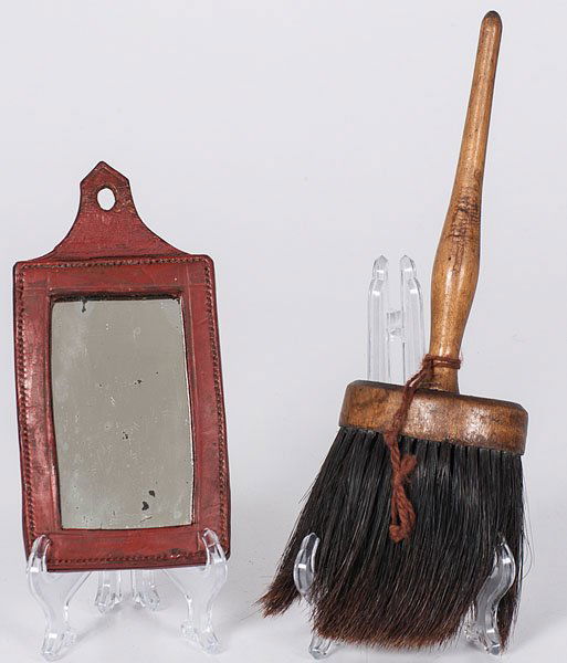 Leather Framed Hand Mirror and Horsehair Brush : Leather Framed Hand Mirror and Horsehair Brush American, 19th century. A red tanned leather rectangular hand mirror and a horsehair brush with a turned wooden handle; brush lg. 11.75 in.