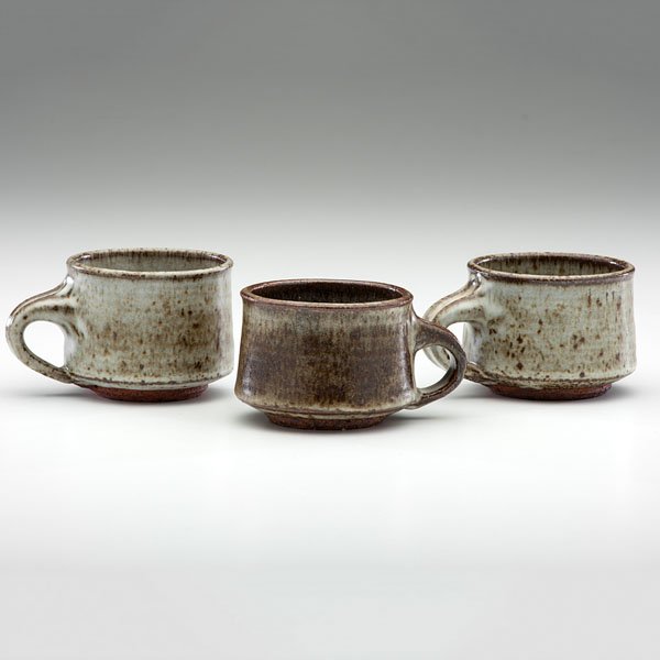 Vivika Heino (1910-1995; USA) and Otto Heino (1915-2009;: Vivika Heino (1910-1995; USA) and Otto Heino (1915-2009; USA) Rare Three Handled Cups ca 1948 Glazed stoneware; each ht. 2.75, dia. 3.5 inches Each stamped V & O on base. Highly influential early So