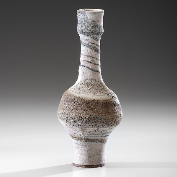 Lucie Rie (1902-1995; Austria/UK) : Lucie Rie (1902-1995; Austria/UK) Narrow Rim Bottle ca 1986 Stoneware: ht. 11, dia. 4.5 in. Artist stamp on base. The "swirl" crater glaze by Lucie Rie is one of her most sought-after and this el