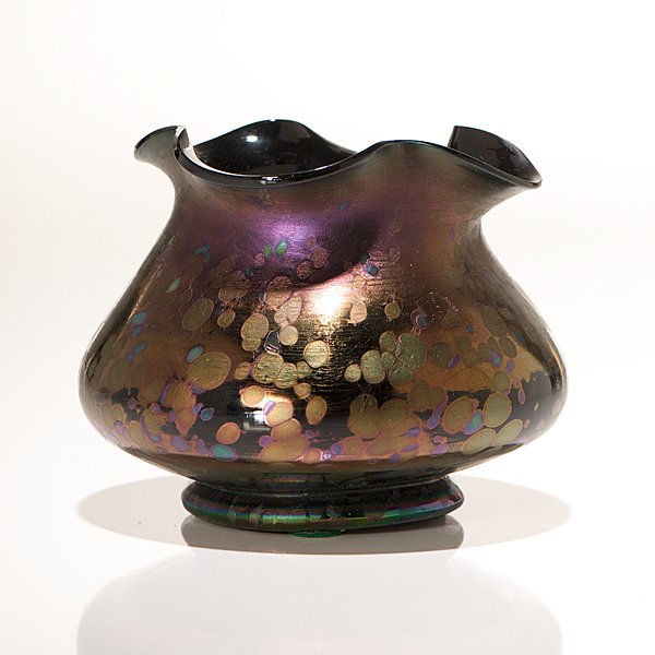 Loetz Glass Vase : Loetz Glass Vase Austrian, early 20th century. A Loetz iridescent amethyst vase having a squat form with a pinched rim and oil spot decorations; ht. 4 in.