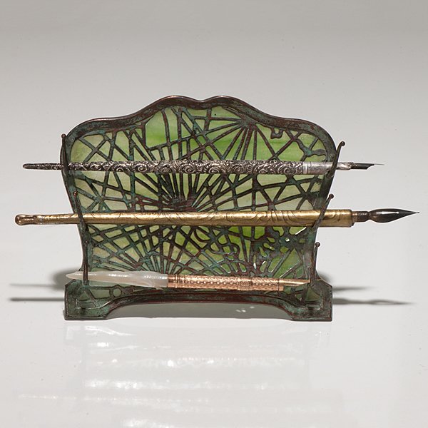 Tiffany Studios Pine Needle Pen Rack : Tiffany Studios Pine Needle Pen Rack A Tiffany Studios pine needle pen rack with green slag glass. Signed Tiffany Studios New York. Includes three fountain pens from Aiken, Lambert & Co., Mark Ferth