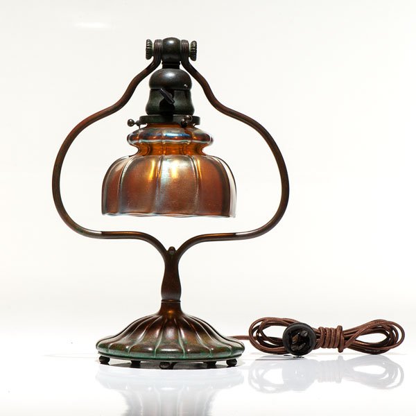 Tiffany Studio Desk Lamp : Tiffany Studio Desk Lamp American, 1902. A Tiffany Studios desk lamp having a favrile shade on a beautifully patinated bronze base. inside fitting of shade marked L.C.T. Favrile. Underside with the