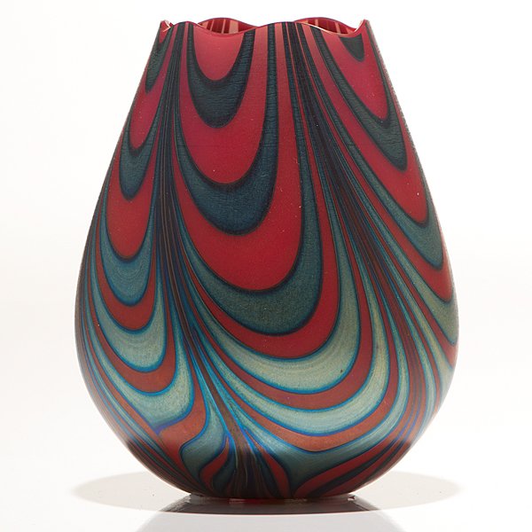 Charles Lotton Pulled Drape Vase : Charles Lotton Pulled Drape Vase American, 1982. A Charles Lotton vase with a pulled drape design with blue lustre against a mandarin red background. Outside of bottom rim etched Charles Lotton 19