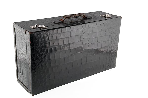 Mark Cross Alligator Leather Suitcase : Mark Cross Alligator Leather Suitcase English, 20th century. A Mark Cross alligator leather suitcase featuring a black leather exterior with a burgundy interior with leather straps. Latches and exte