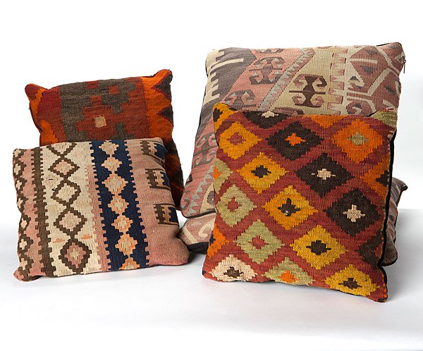 Kilim Pillows and Throw : Kilim Pillows and Throw 20th century. A group of five pillows, two largest matching and a brightly colored wool blend throw; largest pillow 23 x 22 in., throw 128 x 61 in.