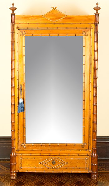 Faux Bamboo Mirrored Armoire : Faux Bamboo Mirrored Armoire American (probably New York) 1880s to 1900. An Aesthetic Movement armoire in maple, turned to resemble bamboo, having outset ring-turned stiles, a door with framed mirr