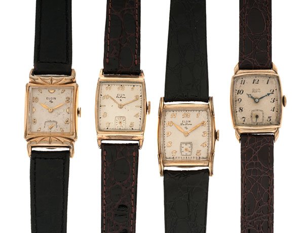 Elgin Mid-Century Wrist Watches : A group of four gold-plated Elgin watches including one 1944 558, one 1949 555, one 1951 624 and one 1956 673. All have aftermarket leather straps. All appear original including dials and hands.