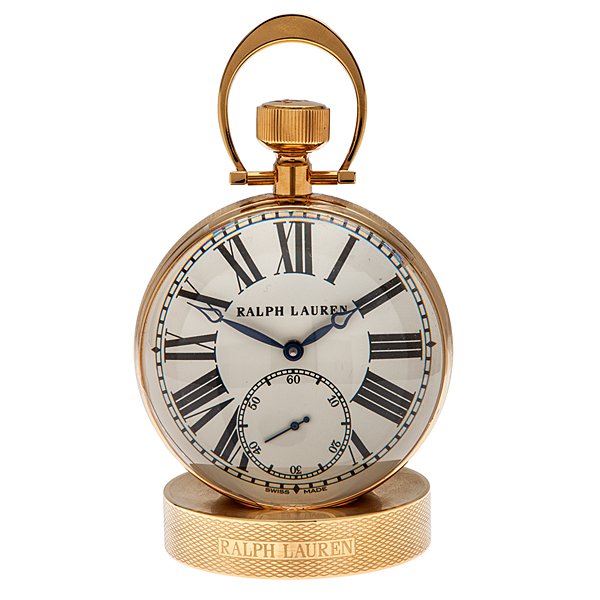 Ralph Lauren Glass Ball Paper Weight Clock : A Ralph Lauren magnified glass ball paper weight clock. Seventeen jewel Swiss Ralph Lauren manual-wind movement. Ralph Lauren base. Subsidiary seconds dial. With original packaging. 2.5" diameter.