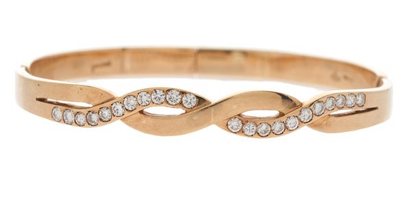 Gio Caroli Diamond Bangle Bracelet in 18 Karat : An 18k yellow gold Gio Caroli hinged bangle bracelet featuring twenty-two SI1-SI2, H-I color round diamonds weighing approximately .50 carats total weight. The diamonds are inlaid in a crossover des