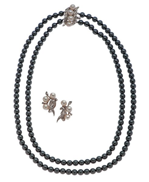 Marcasite and Pearl Necklace with Pearl and Diamond: A double strand 6mm marcasite bead necklace with a 14 karat white gold clasp. Clasp contains four 6.5mm pearls in an engraved leaf pattern background complimented by a pair of 14k white gold clip back