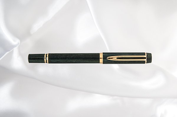 Waterman "Man 100 Fontainebleau" Fountain Pen : Waterman "Man 100 Fontainebleau" Fountain Pen This dyed green wooden barrel and cap pen is a departure from Waterman's regular resin line, and was one of the models that filled the line of the short