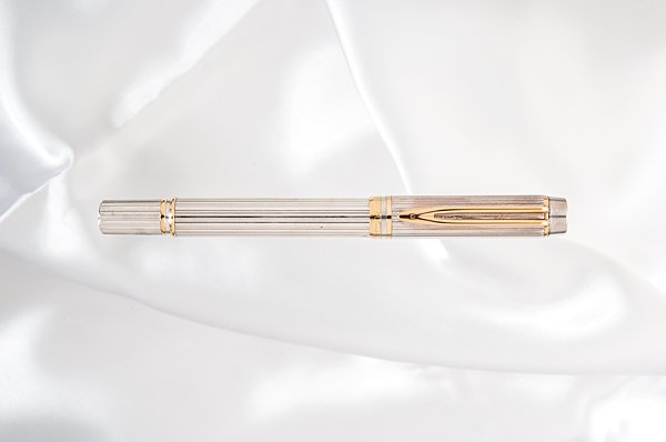 Waterman "Man 100" Sterling Silver Fountain Pen : Waterman "Man 100" Sterling Silver Fountain Pen Commemorating Waterman's 100th anniversary, this ribbed solid, hallmarked sterling silver body and cap contrasts the gold clip and accent rings. It is