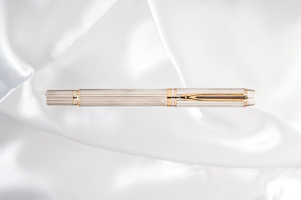 Waterman "Man 100" Sterling Silver Fountain Pen : Waterman "Man 100" Sterling Silver Fountain Pen Commemorating Waterman's 100th anniversary, this ribbed solid, hallmarked sterling silver body and cap contrasts the gold clip and accent rings. It is