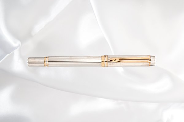 Waterman "Man 100" Sterling Silver Fountain Pen : Waterman "Man 100" Sterling Silver Fountain Pen Commemorating Waterman's 100th anniversary, this ribbed solid, hallmarked sterling silver body and cap contrasts the gold clip and accent rings. It is
