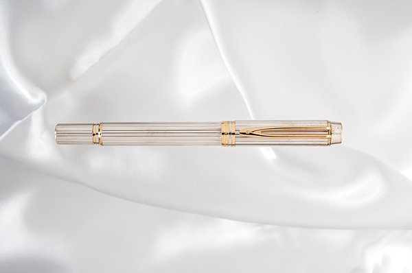 Waterman "Man 100" Sterling Silver Fountain Pen : Waterman "Man 100" Sterling Silver Fountain Pen Commemorating Waterman's 100th anniversary, this ribbed solid, hallmarked sterling silver body and cap contrasts the gold clip and accent rings. It is