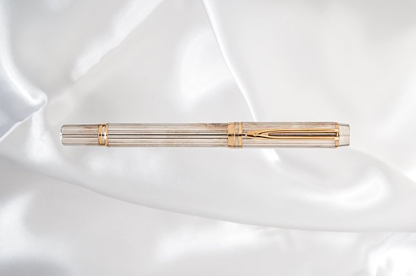 Waterman "Man 100" Sterling Silver Fountain Pen : Waterman "Man 100" Sterling Silver Fountain Pen Commemorating Waterman's 100th anniversary, this ribbed solid, hallmarked sterling silver body and cap contrasts the gold clip and accent rings. It is