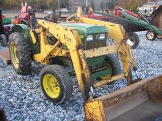 VERY NICE JOHN DEERE 950 TRACTOR WITH LOADER: John Deere 950 tractor with Bradco loader. Very nice condition, 874 hours, power steering, and rear wheel weights. SN: 950X007687 lot#17893 This is an auction to be held on our premises, on Monday Nov