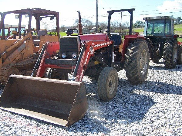 Nice Massey Ferguson 261 Farm Tractor w/ Loader!!: Nice tractor came off a local farm. Tractor comes with: 2wd, Power Steering, Bushhog Q/A Loader, Joystick, 1 Remote, 2112 Hours, Foldable Rops, Serial#5971C38007, Lot#34654. This is an auction to be h