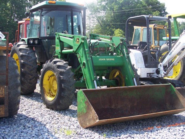 1990 John Deere 2755 4x4 Tractor with Loader and C: This tractor came of a Virgina farm and is powered by a 76 horsepower PTO, and has hours. This tractor has: 245 loader, 2 rear remotes, manual trans, joystick loader valve,cab with heat and air, and R