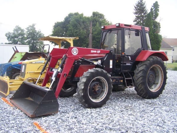 Case IH 956XL 4x4 Farm Tractor with Loader and Cab: This is a 1991 Case 956 XL 4x4 Farm tractor with Bush Hog 2846 loader. This tractor is powered by a 95 horsepower diesel engine with 3960 hours. This tractor has 3 rear remotes, 84" quick attach bucke