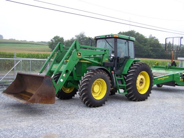 John Deere 7510 4x4 Farm Tractor with JD740 Loader: This is a 2001 John Deere 7510 4x4 Farm Tractor with John Deere 740 loader. This tractor is powered by a diesel engine that has a 115 horsepower PTO and has 2585 houors. This tractor has 90" quick rel