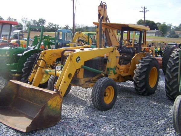 John Deere 2355 Tractor with Loader 60" Bucket: This is a 1990 John Deere 2355 tractor with John Deere 146 Loader. This tractor is powered by a 55 horsepower diesel engine with 1494 hours. This tractor has ROPS with canopy, 60" bucket, manual trans