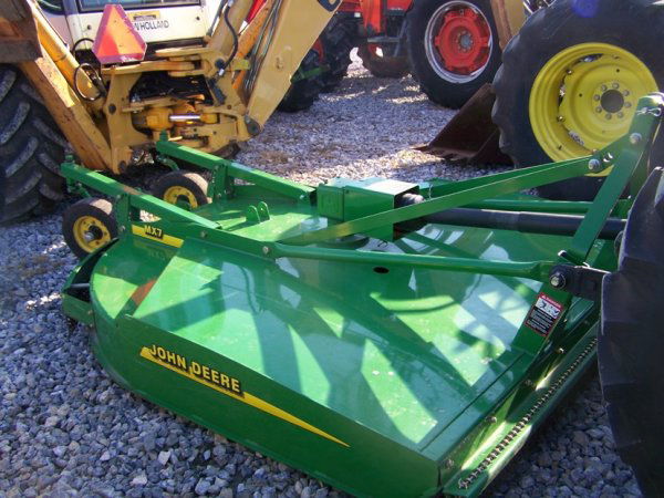 John Deere MX7 7' 3pt Rotary Mower For Tractors: This is a like new John Deere MX7 84" 3pt rotary mower for tractors. This mower has a dual solid rubber tail wheels, front and rear chain kit, mounts to a cat 1 3pt hitch, and runs off a 540 PTO. Tag
