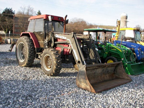 Case IH 5220 4x4 Farm Tractor with cab and Loader: This is a Case IH 5220 Maxxum 5220 farm tractor with cab and loader. This tractor has a diesel engine that has a 80 horsepower PTO. This tractor has synchronized transmission, left hand reverser, Quic