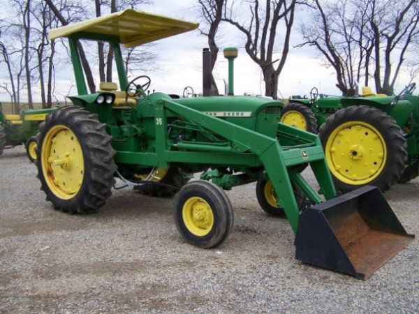 John Deere 2510 Wide Front Tractor with Loader: This is a John Deere 2510 farm tractor with factor wide front and John Deere 35 loader. This tractor has a diesel engine, sycronized transmission, dual remotes, ROPS with canopy, and shows 4757 hours.