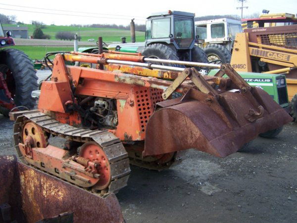 Oliver Antique Crawler Tractor with Loader, Gas En: This is an Oliver crawler loader tractor that came from a dealer on a trade in. We think this is an OC3 tractor but we are not 100% sure. This tractor has a gas engine and metal tracks. We do not know