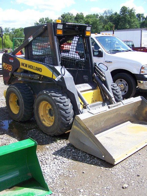 New Holland L170 Skid Steer Loader with OROPS: 2006 New Holland L170 Skid Steer loader with OROPS. This tractor has 52 horsepower diesel engine, aux hydraulics, and 428 hours. Serial #N629663M This is an ABSOLUTE AUCTION. WHICH MEANS ALL ITEMS SEL