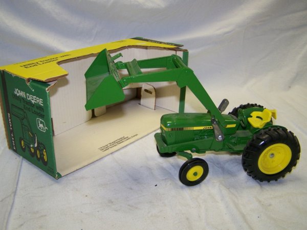 Ertl John Deere Toy Utility Tractor with Loader: Ertl John Deere Toy Utility Tractor with Front End Loader, and Box. This is a due not miss event, you will not believe the Quantity or the QUALITY!!! This auction is to be held at The Seven Valleys Fi