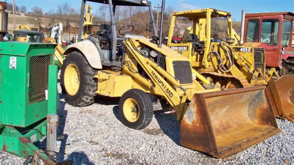 New Holland 555E Tractor Loader Backhoe: New Holland 555E Tractor Loader Backhoe with OROPS, 79 Horsepower, 14' 5" Digging Depth, 88" Front Bucket, 18" Backhoe Bucket, 5545 Hours, and 16.9-38 Rear Tires. Serial #0131011252 Stock #23129 This