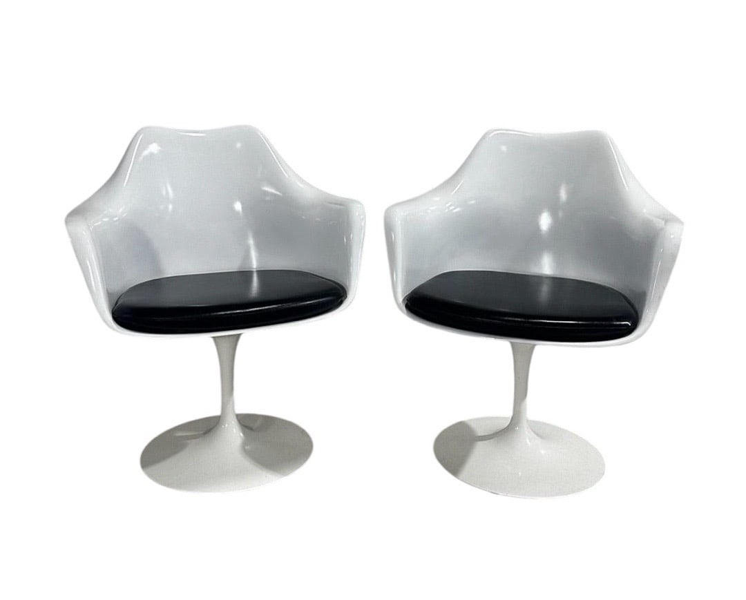 Eero Saarinen for Knoll, Tulip Chairs in Black Leather: Elevate your living space with the exquisite elegance of the Tulip Chairs, a timeless design by Eero Saarinen for Knoll, originally conceived in the 1960s. These iconic pieces are not merely chairs; t