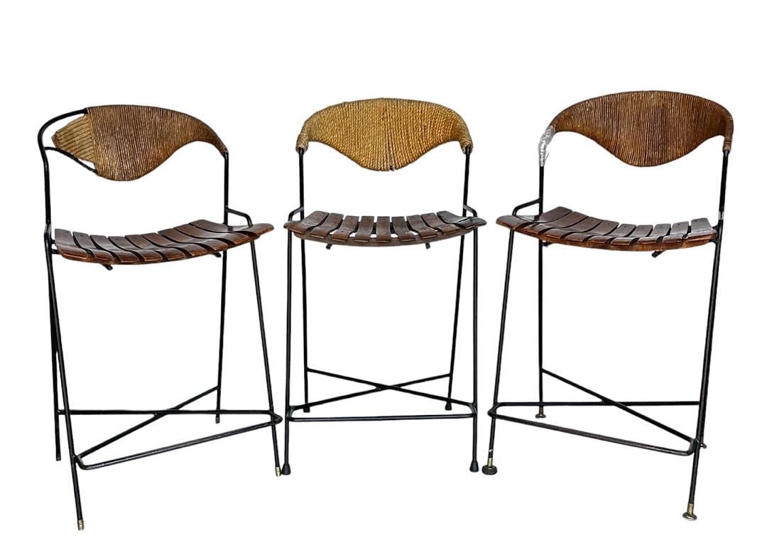 Arthur Umanoff for Raymor Wrought Iron/Wicker Slatted Bar Stools, 1950s: Arthur Umanoff for Raymor Wrought Iron/Wicker Slatted Bar Stools, 1950s.Measures35.5” tall 17.5” wide 15” deep seat height 24” seat depth 14’PLEASE BE ADVISED, THE JOLIET WAR
