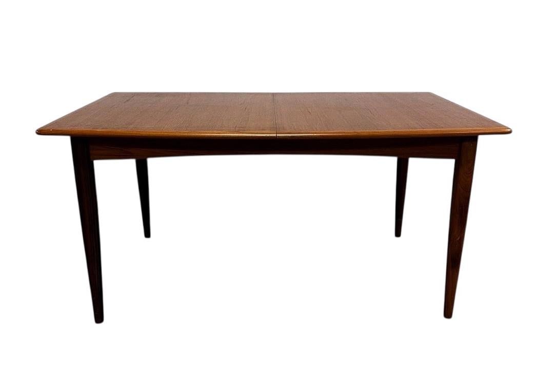 Style of Arne Vodder, Mid-Century Teak Hidden Leaf Dining Table, 1960s: Style of Arne Vodder, Mid-Century Teak Hidden Leaf Dining Table, 1960s. 29.75"H x 43"W (extended 71"W) x 33"D