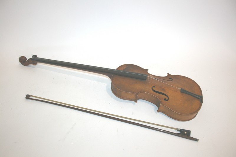 ANTIQUE VIOLIN an interesting violin with an elongated: ANTIQUE VIOLIN an interesting violin with an elongated neck and one string and tuning peg, also with a bow. With a label inside, Medio Fino, Trade Mark. 86cms long