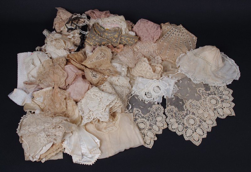 A BAG OF NEEDLE LACE TRIMS, COLLARS & VANITY VESTS A: A BAG OF NEEDLE LACE TRIMS, COLLARS & VANITY VESTS A bag of lace containing 19th century hand worked trims, cuffs, collars and odds and ends collected over decades. (quantity)