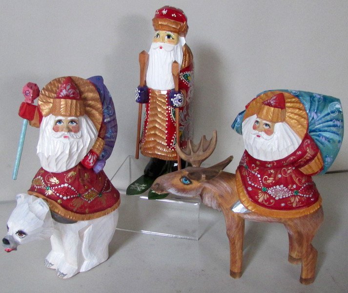 3 Carved and Painted Santa Figures: The first riding a Polar Bear, the second on the back of a Reindeer, and the third on Skis. Each figure signed by the artist. Tallest (skier) 7 1/4 inches.