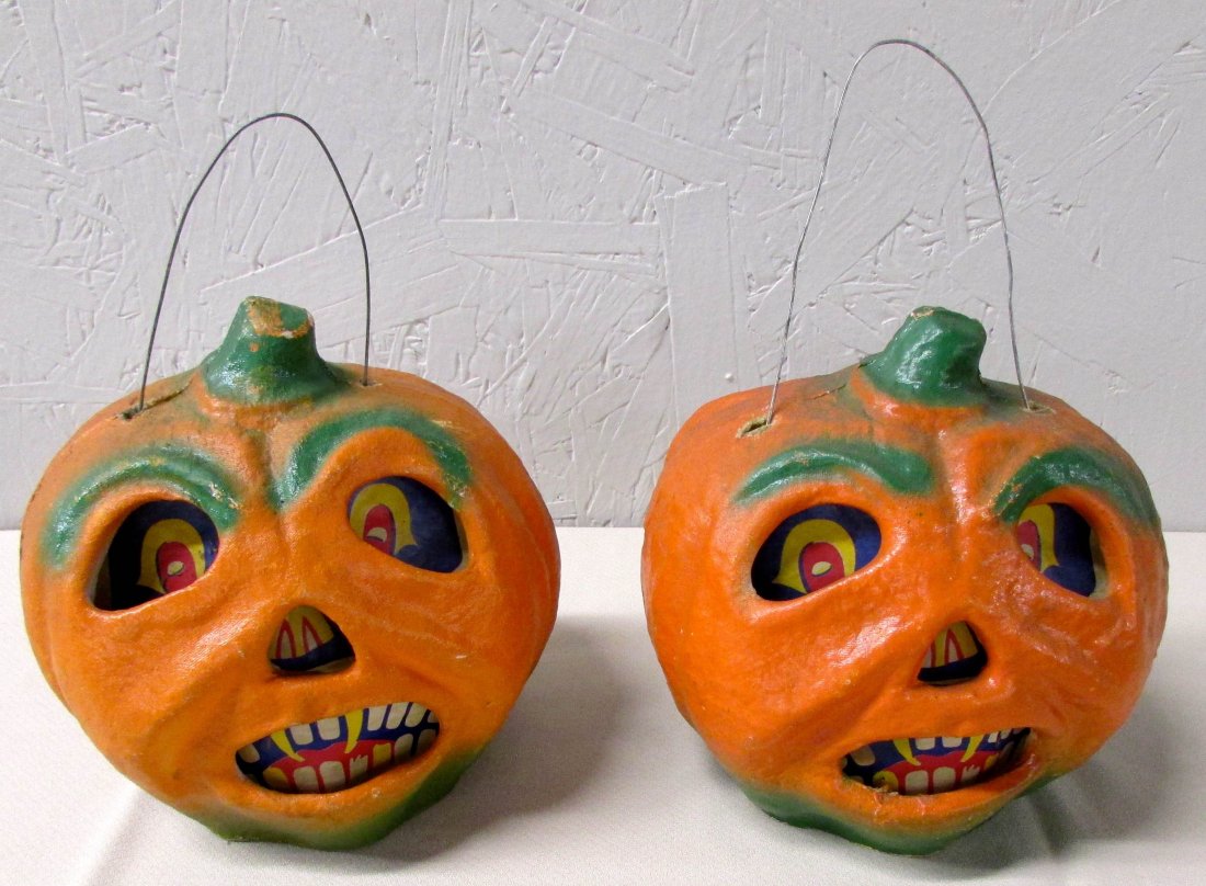 Pair of Paper-Mache Halloween Jack-O-Lanterns: Each with original inserts of eyes and teeth, one still fitted with candleholder. Height 7 1/2 inches.