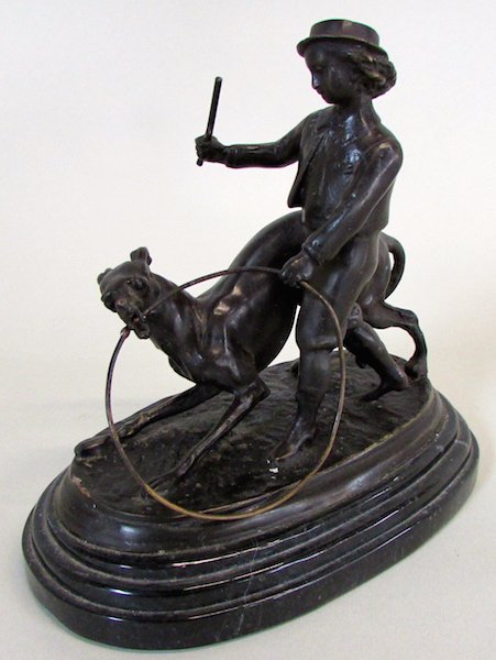 Bronze of Boy with Greyhound signed "Barrie": Depicting a boy with stick and hoop with a greyhound tugging at the hoop. Mounted on a marble base, the sculpture signed "Barrie", possibly a copy of an original by Antoine Louis Barye. Height 7".