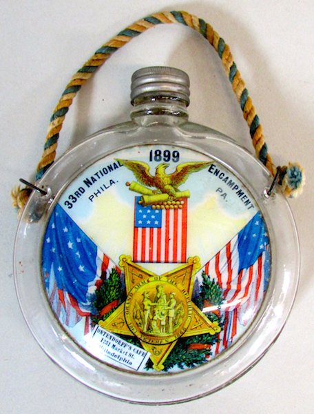 1899 Civil War 33rd Encampment Glass Flask: The glass flask with screw top and stamped "U S" on one side, the opposite side painted with an eagle atop an American flag, above the G.A.R. Service Medal flanked by flags and titled "33rd National E