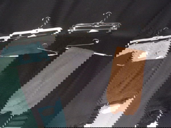 Barbra Streisand Knit Slacks Lot: A lot of seven pairs of knit slacks. Labels are: DKNY, Calvin Klein, Claude Barthelemy. Sizes: M-L. In Grey, Black, Tan. Wool and Acrylic. (878, 914, 909, 924, 864). Condition: Good.