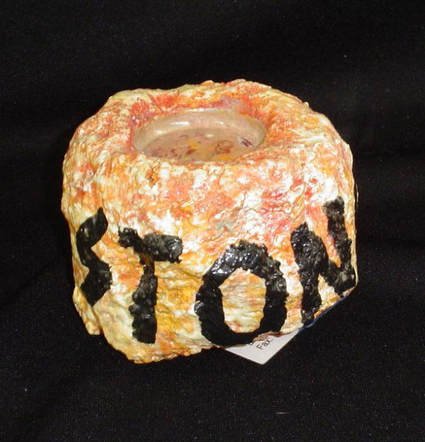 Flintstone Table Accessories: The lot includes a "STONO" (sterno) holder, multi shades of orange 69196 and a multi-coloredcandle holder for the table, 5-1/2" x 3" 69197. Condition: Good