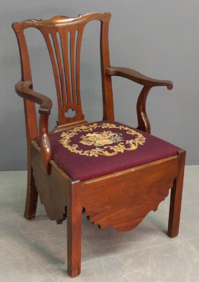 Potty chair: Chippendale mahogany potty armchair, 18th century, with needlepoint seat. 37"h. x 23"w.