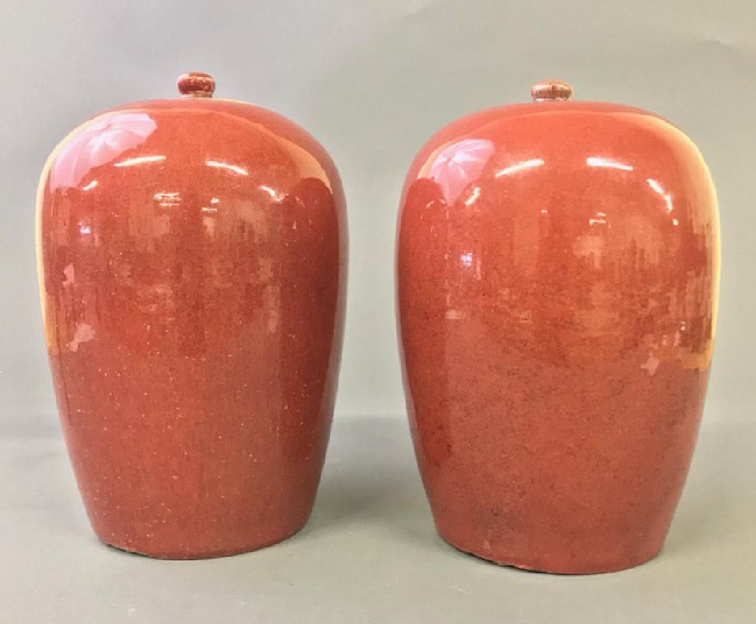 Pair of Asian Porcelain Herbal Jars: Pair of Asian porcelain sang de boeuf (oxblood) glazed herbal jars, 19th c, 12"h