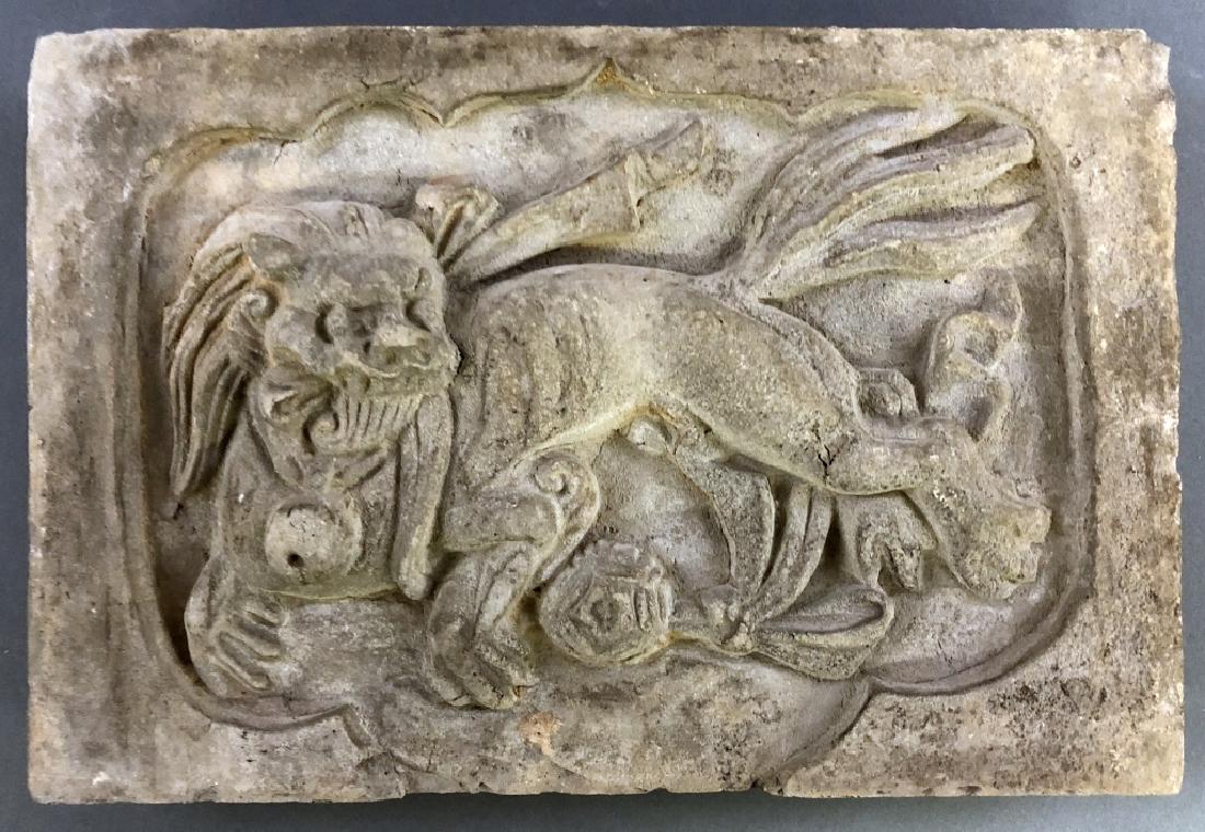 Chinese Gray Terracotta Tile Representing a Lion: Chinese gray terracotta tile representing a lion, 17th c, 8 1/4"h x 12 1/2"w