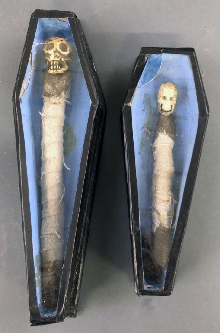Two Miniature Wood Coffins: Two miniature wood coffins, each with bone or composition skulls, largest 1 3/4"h x 11"l