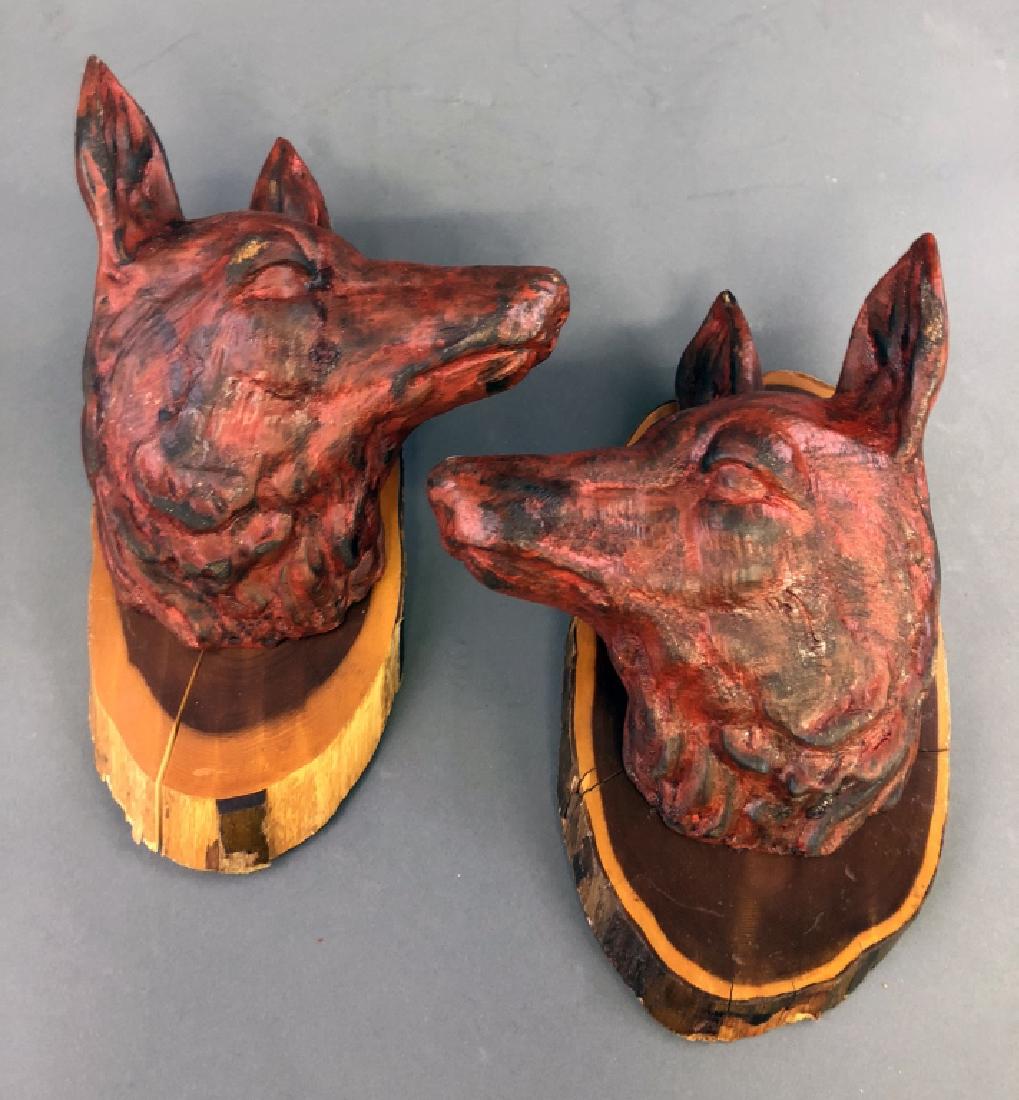 Two Wood Carved Fox Heads: Two wood carved fox heads, German, each mounted on cedar plaques, signed on back and dated 1941 & 1942, 13"h x 9"w