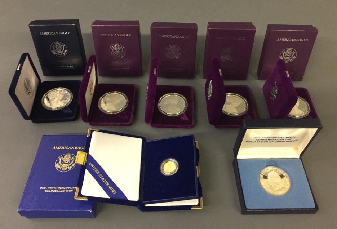 U.S. Mint One-Tenth Ounce Gold Bullion Coin: U.S. Mint one-tenth ounce U.S. gold bullion American Eagle coin, together with five silver Walking Liberty coins, and a Thomas Jefferson Bicentennial coin. Gold coin date: 1992. Silver dollar coin dat